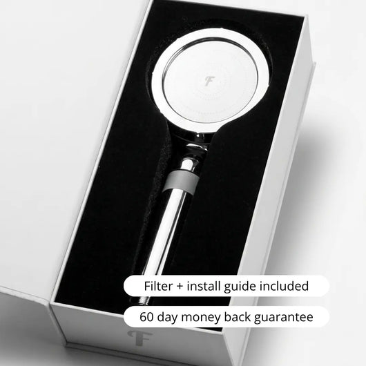 Flowy handheld filtered showerhead in gift box with filter, install guide, and 60-day money-back guarantee